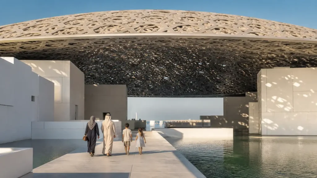 Family visiting a contemporary Abu Dhabi museum beneath a patterned dome