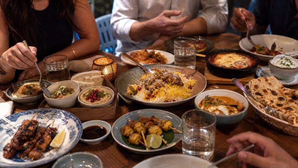 A lively Dubai restaurant table filled with varied good value dishes