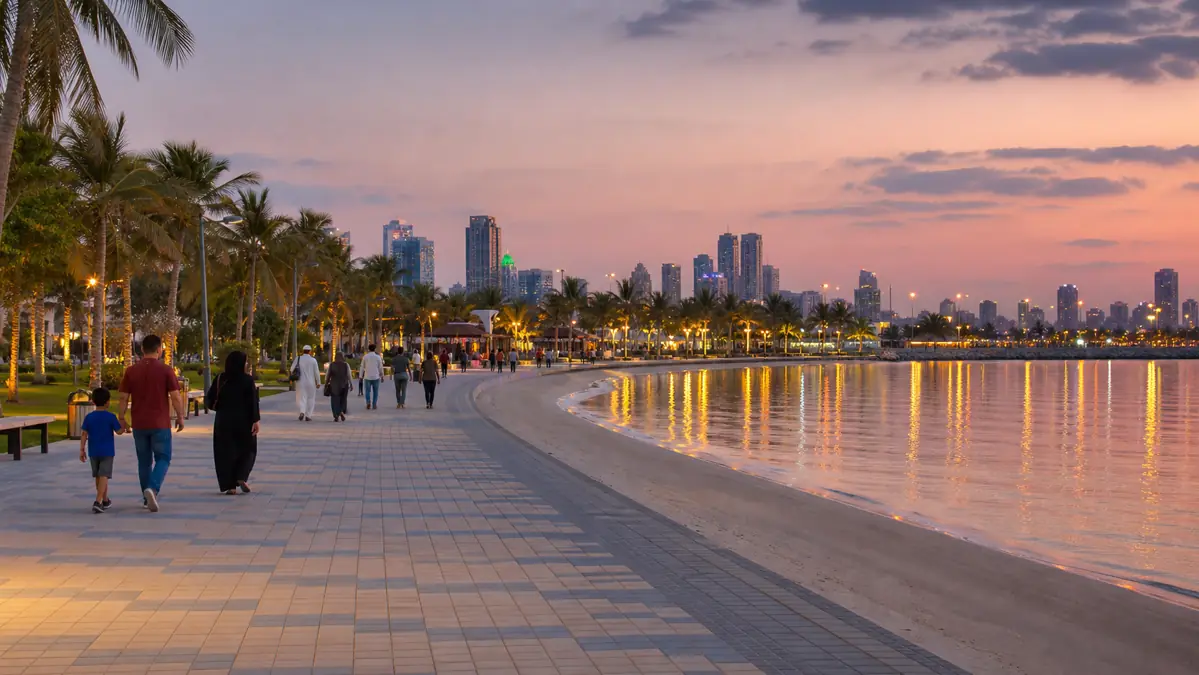 Families enjoying Khor Al Mamzar Beach in Dubai at dusk