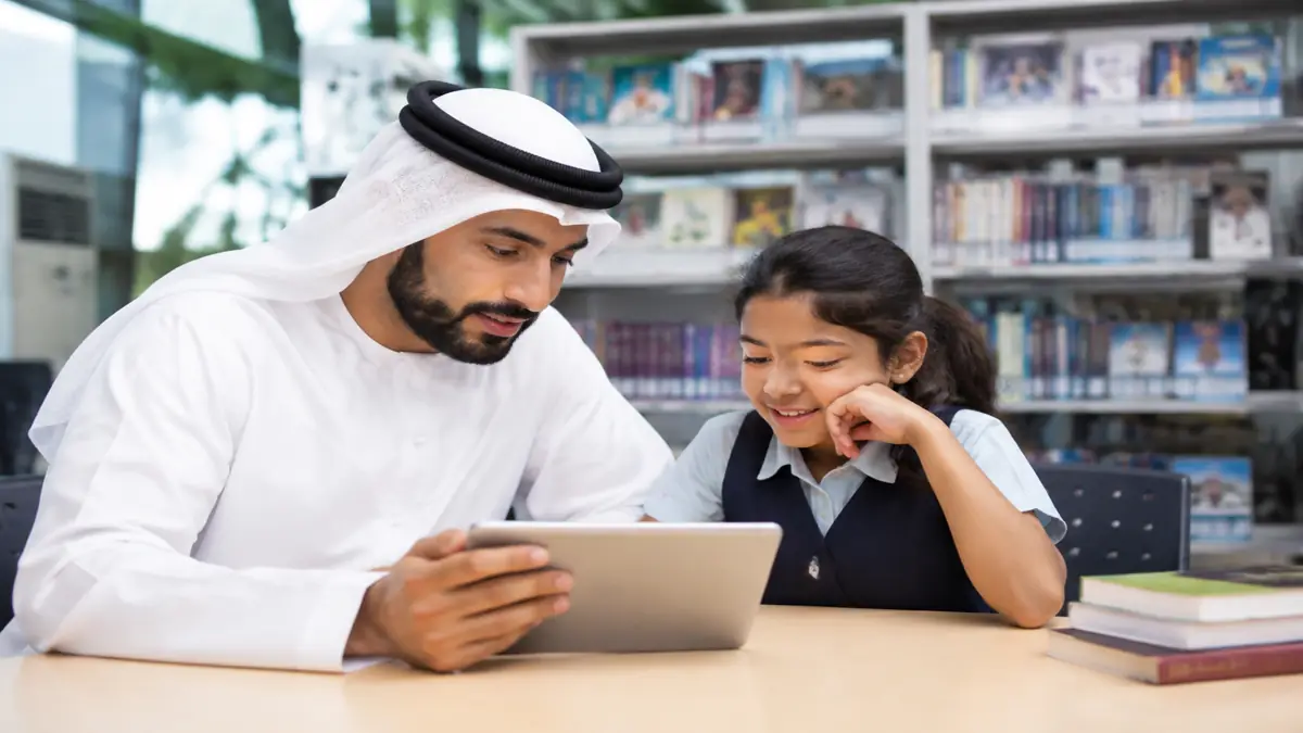 Parent and child reviewing Dubai private education options